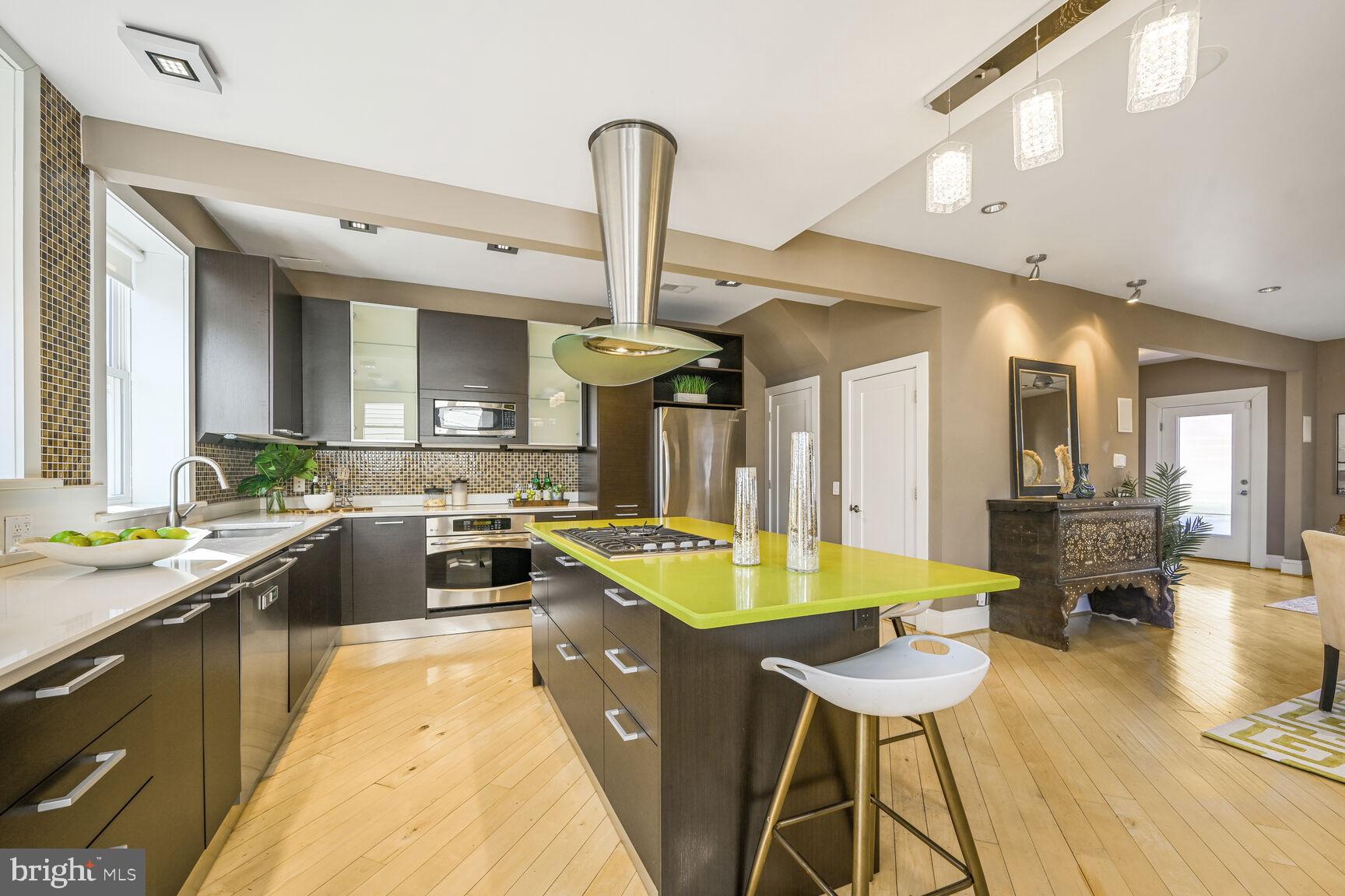 608 Rittenhouse Street Northwest Washington, DC 20011 - Photo 5 of 16 a kitchen with a sink a counter top space and stainless steel appliances