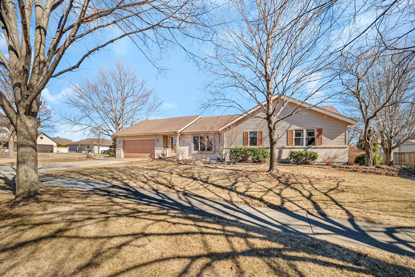 214 Deerpath Drive Minooka, IL 60447 - Photo 1 of 25 a view of a house with snow on the side of street