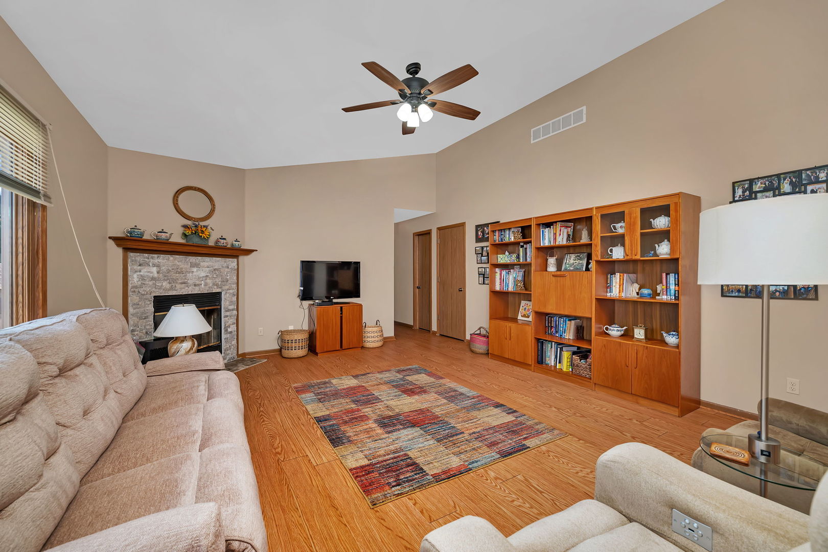 214 Deerpath Drive Minooka, IL 60447 - Photo 11 of 25 a living room with furniture or couch and a fireplace