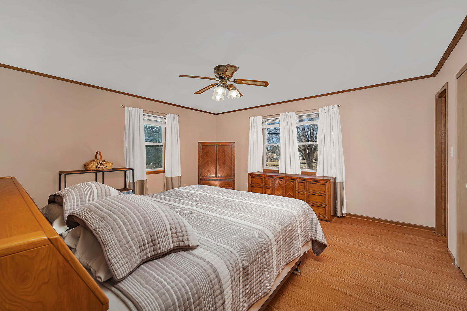 214 Deerpath Drive Minooka, IL 60447 - Photo 14 of 25 a bedroom with a large bed and a chandelier