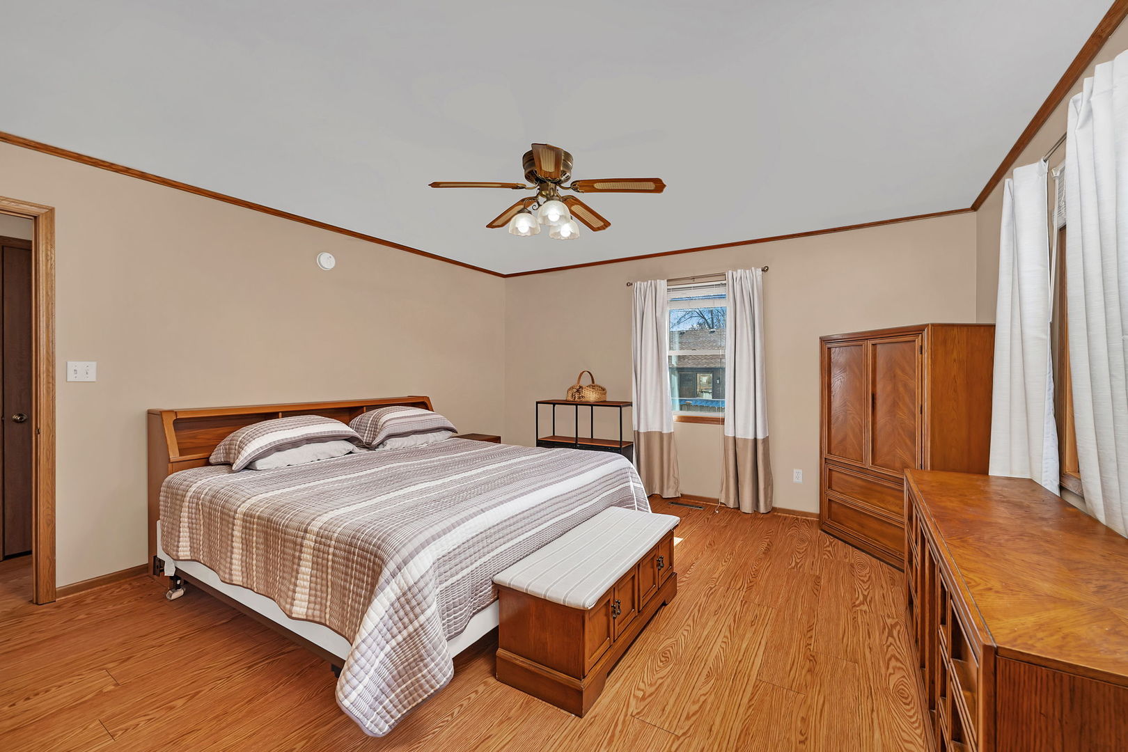 214 Deerpath Drive Minooka, IL 60447 - Photo 15 of 25 a bedroom with a bed and wooden floor