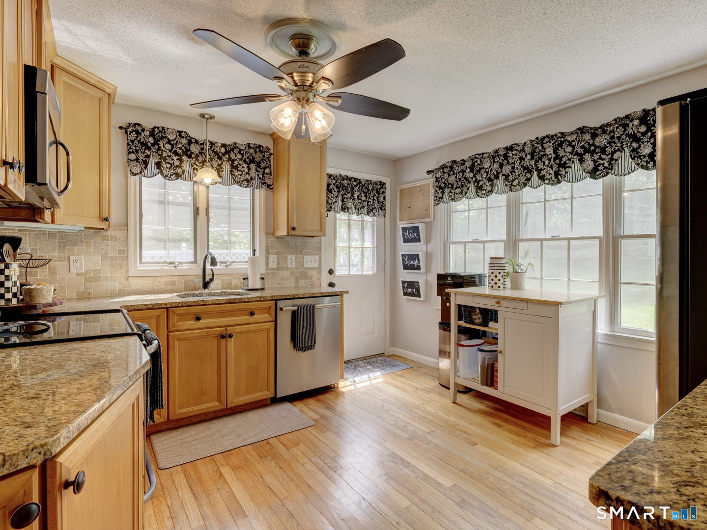39 Freedom Drive Canton, CT 06019 - Photo 12 of 37 a kitchen with a refrigerator a sink and dishwasher with wooden floor