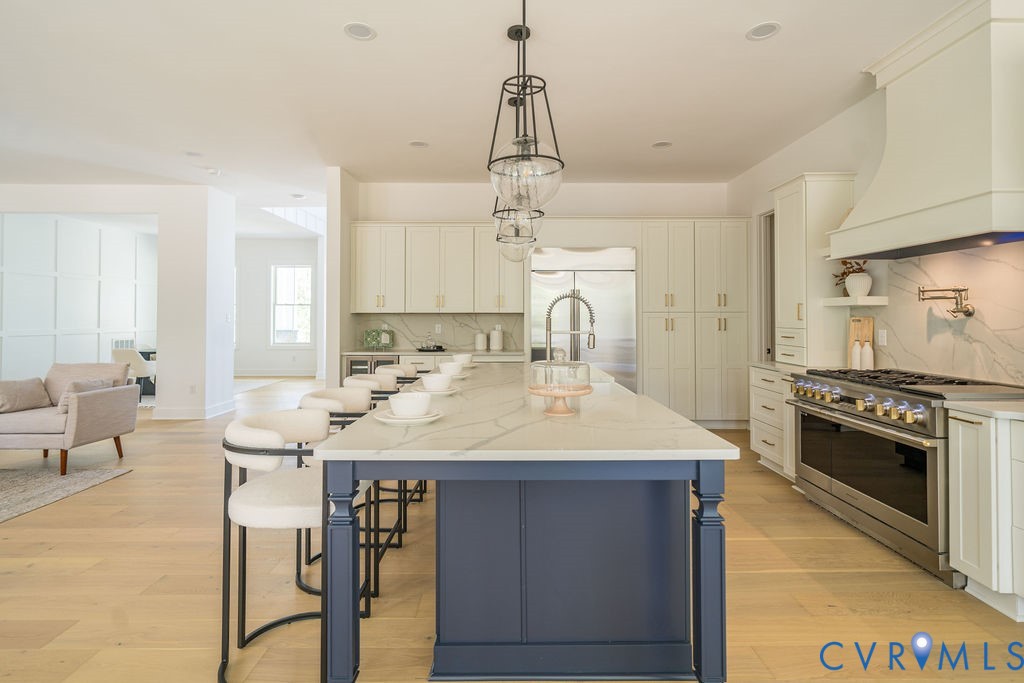 1175 Cardinal Crest Terrace Midlothian, VA 23113 - Photo 13 of 50 a kitchen with a stove a sink and a refrigerator