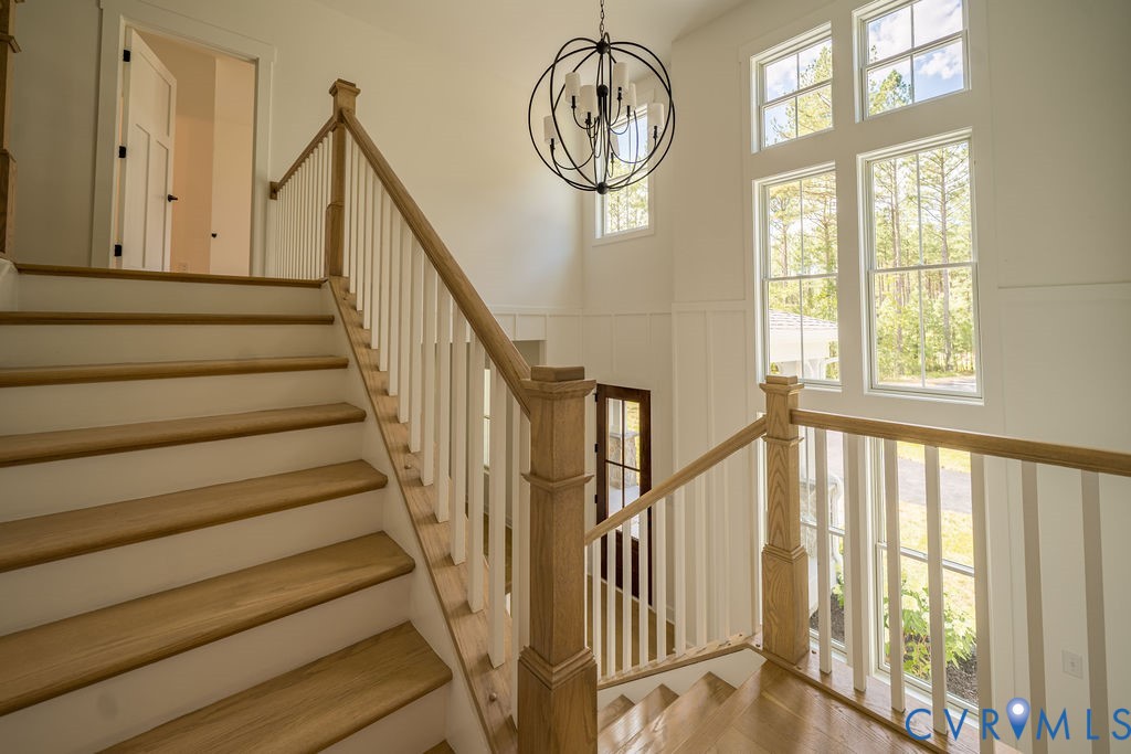 1175 Cardinal Crest Terrace Midlothian, VA 23113 - Photo 31 of 50 a view of staircase with railing and a large window