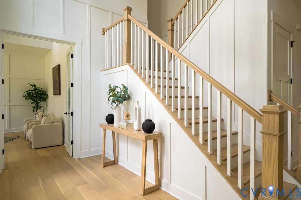 1175 Cardinal Crest Terrace Midlothian, VA 23113 - Photo 5 of 50 a view of staircase with lots of frames on wall and wooden floor
