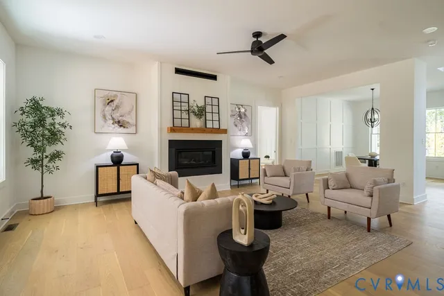 a kitchen with stainless steel appliances kitchen island granite countertop a table and chairs in it