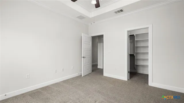 a view of an empty room and closet