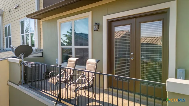 a view of a balcony with chair