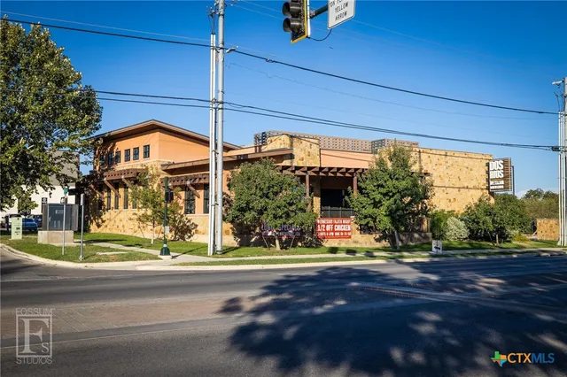 a view of a house with a street