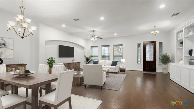 a living room with fireplace furniture and a flat screen tv