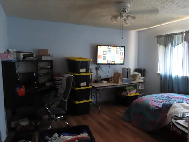 a bedroom with a workspace