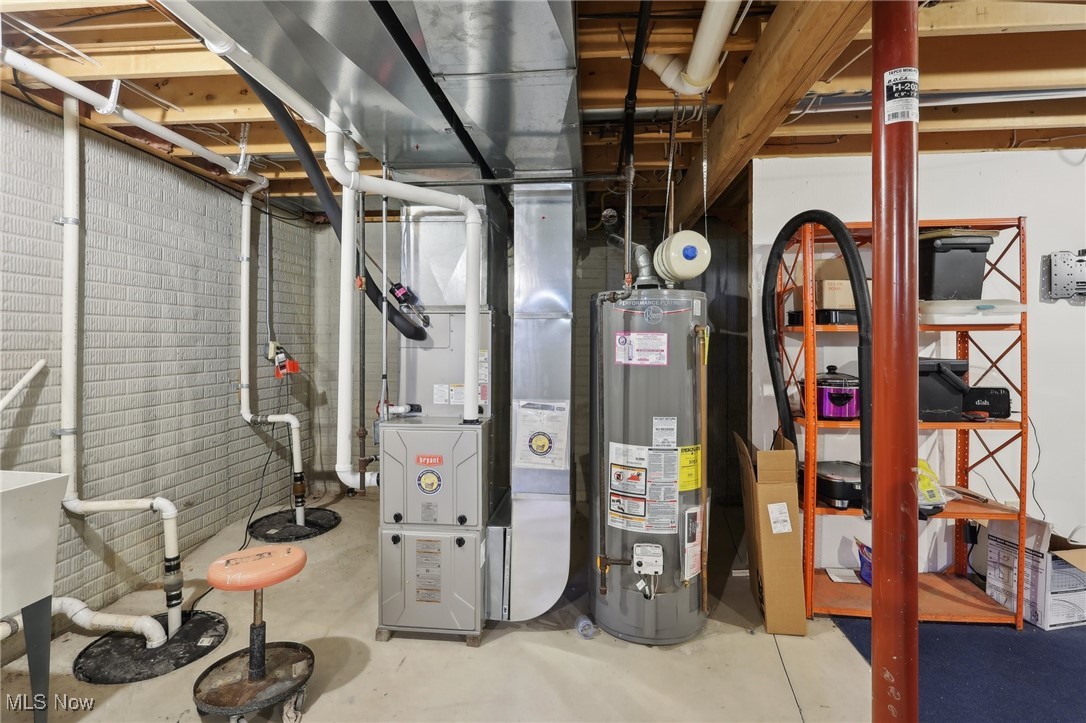 41553 Parsons Road Lagrange, OH 44050 - Photo 40 of 50 Unfinished below grade area featuring water heater and heating unit