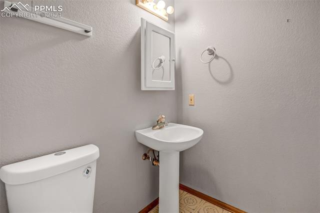8549 Cedar Mountain Road Divide, CO 80814 - Photo 9 of 31 Half Bath off of living room