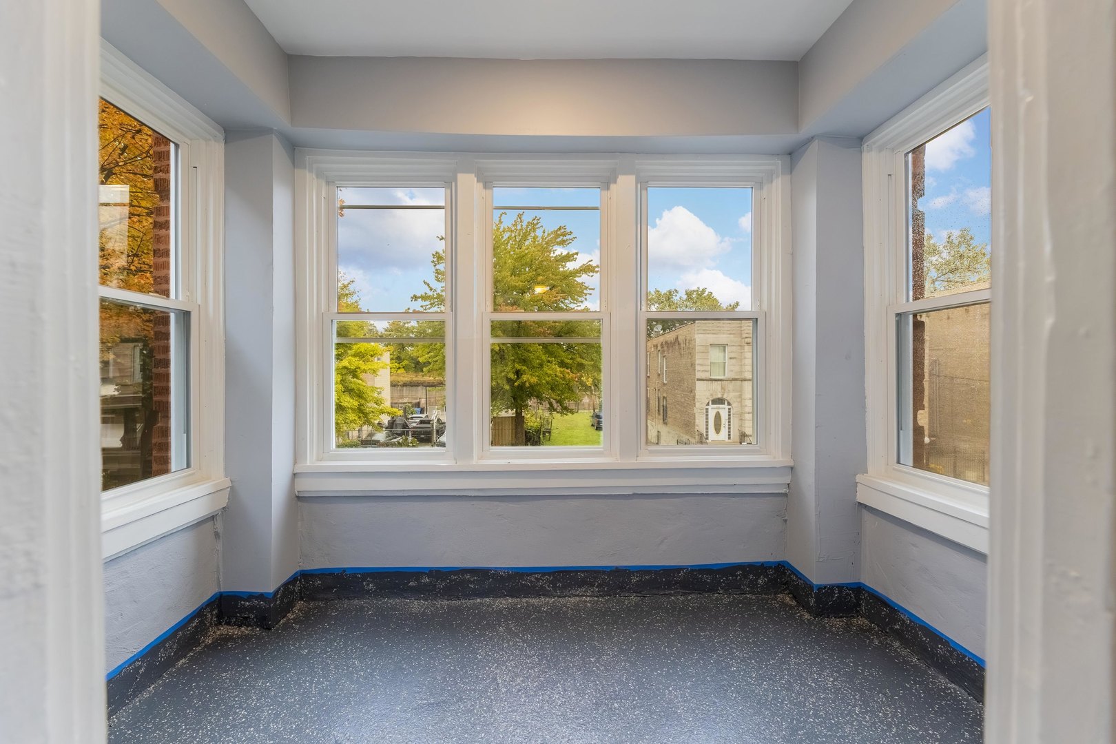 3821 West Fillmore Street, Unit 2B Chicago, IL 60624 - Photo 7 of 11 an empty room with windows