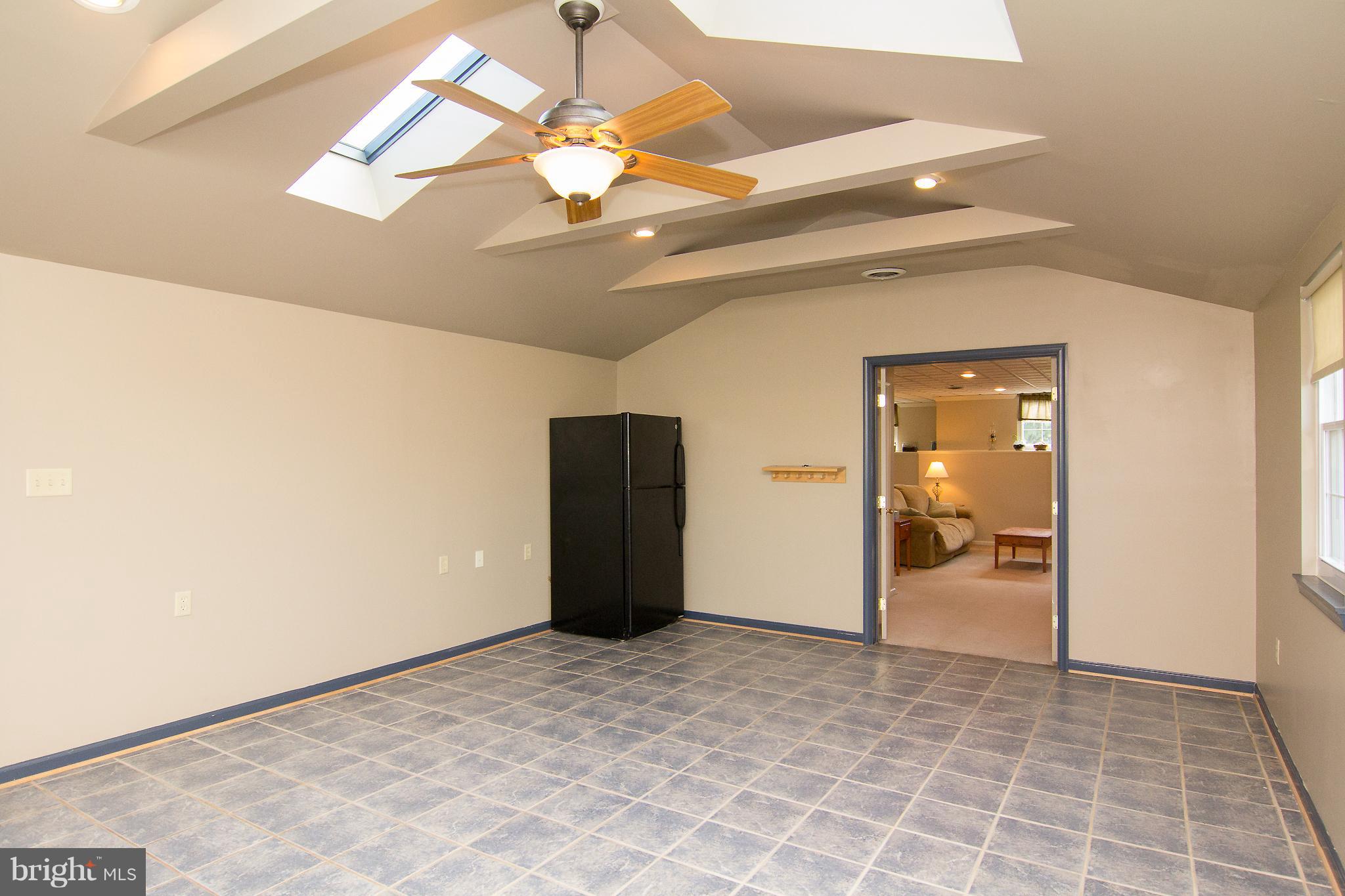 824 Lucabaugh Mill Road Westminster, MD 21157 - Photo 23 of 30 Large rec room with ceramic tile