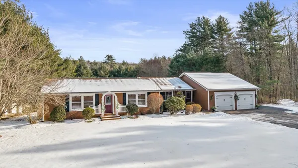 a house with a tree in front of it