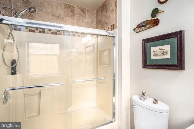 a bathroom with a shower and a sink