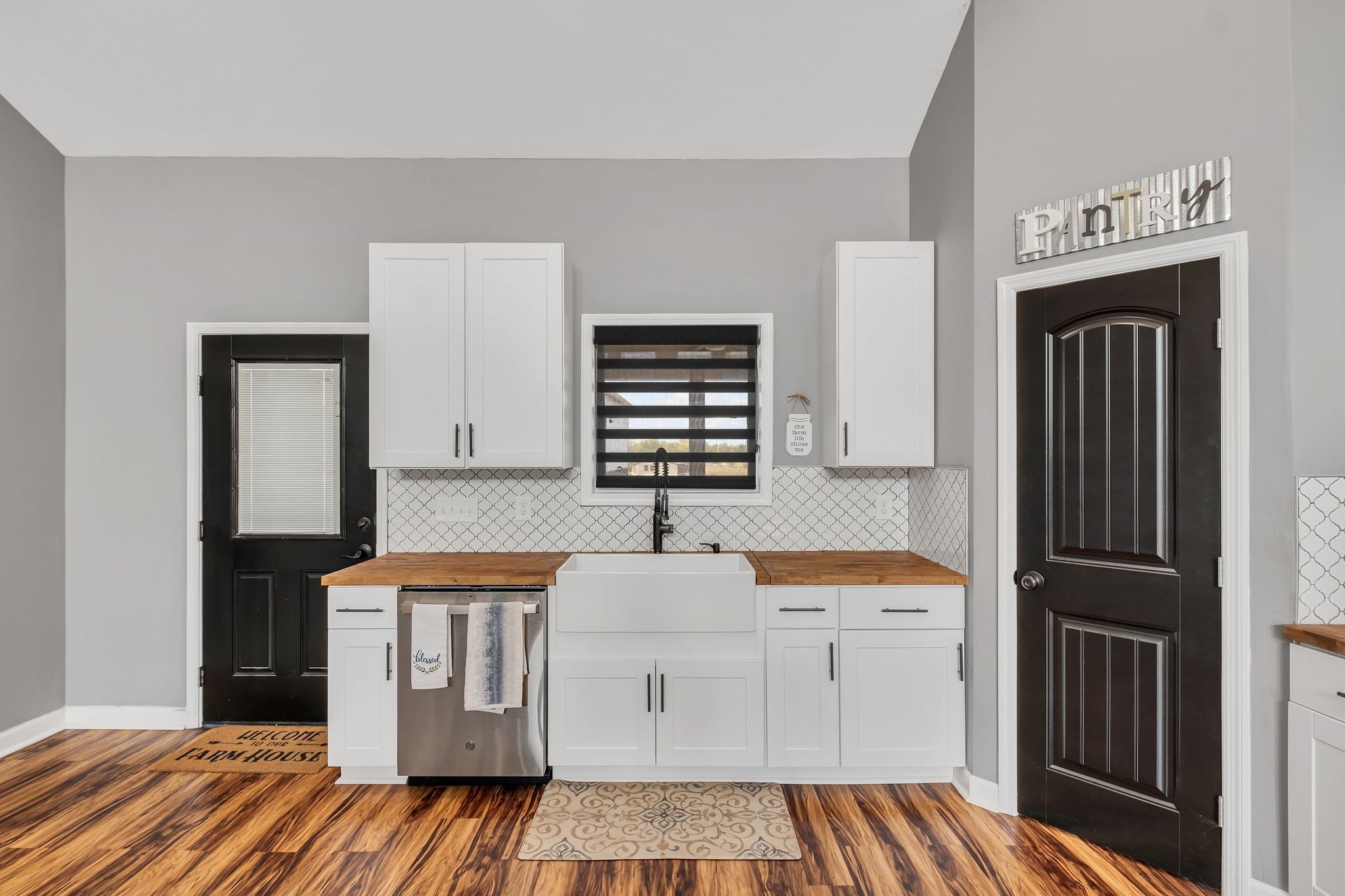 310 Christopher Lane Lawrenceburg, TN 38464 - Photo 13 of 50 a kitchen with white cabinets and sink