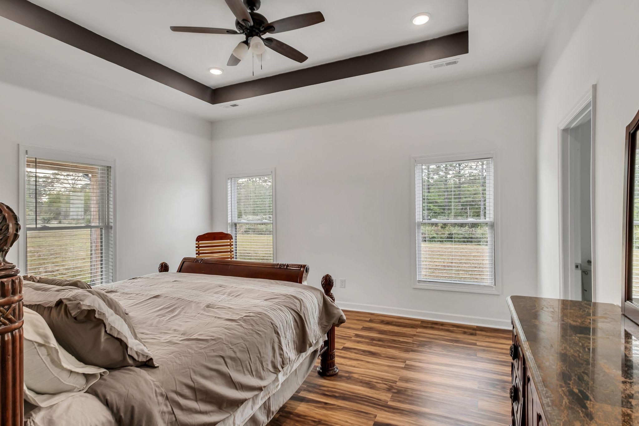 310 Christopher Lane Lawrenceburg, TN 38464 - Photo 15 of 50 a bedroom with a bed and wooden floor