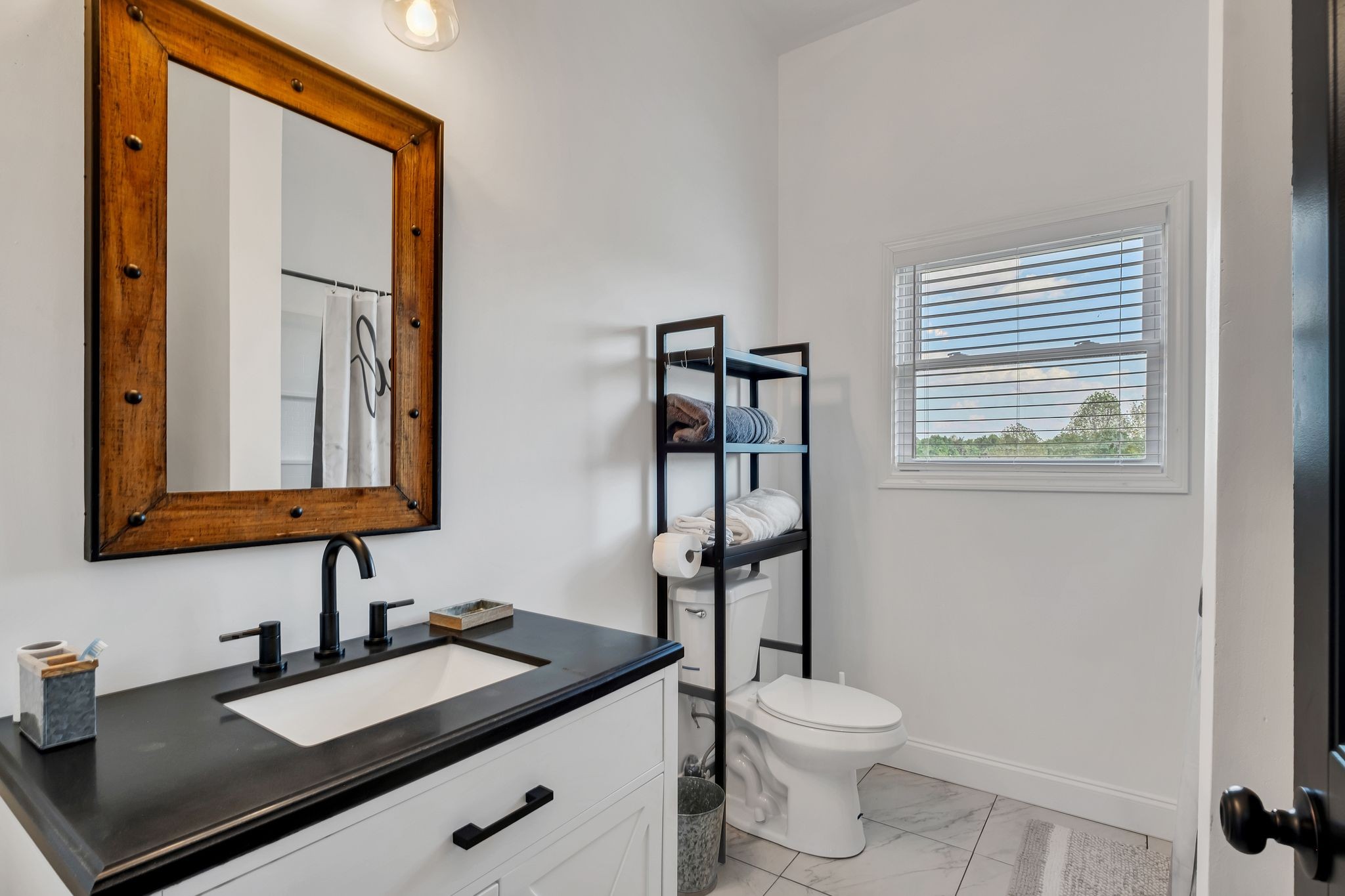 310 Christopher Lane Lawrenceburg, TN 38464 - Photo 24 of 50 a bathroom with a granite countertop sink toilet and mirror
