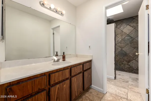 a bathroom with a sink and a mirror