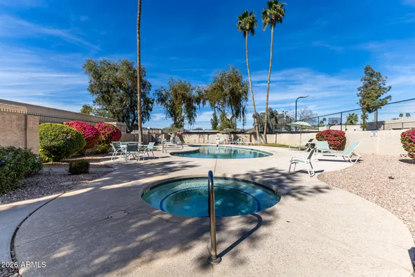 a view of a swimming pool with a patio