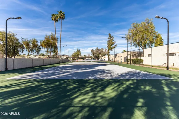 a front view of a house with a garden and yard