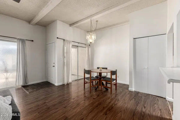a view of a dining room with furniture and wooden floor