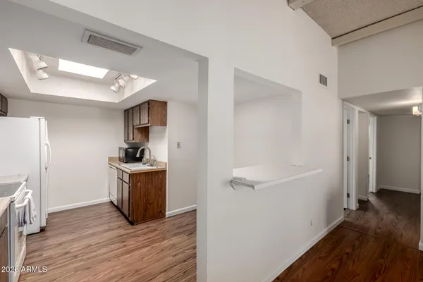 a view of a kitchen from the hallway