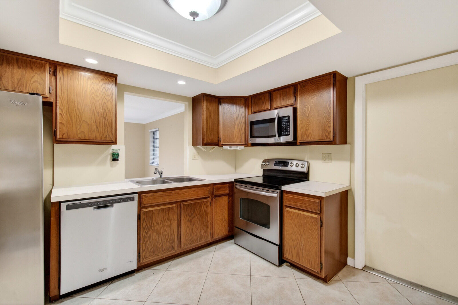 3951 Northeast 19th Road, Unit 1701 Pompano Beach, FL 33064 - Photo 35 of 82 a kitchen with stainless steel appliances granite countertop a sink stove and refrigerator