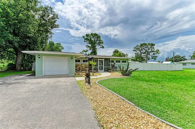 a view of a house with garden