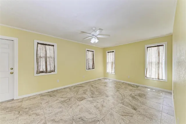 a view of an empty room with a window