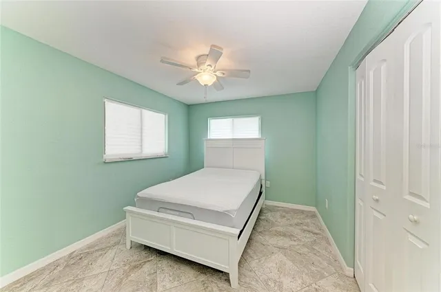 a room with a bed and a window