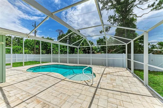 a view of yard with patio