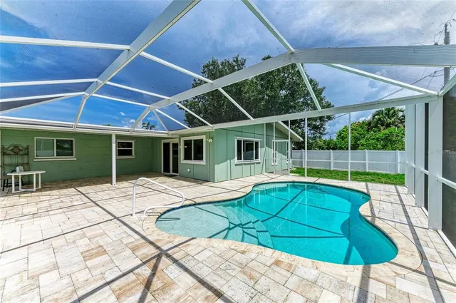 a front view of a house with a yard table and chairs