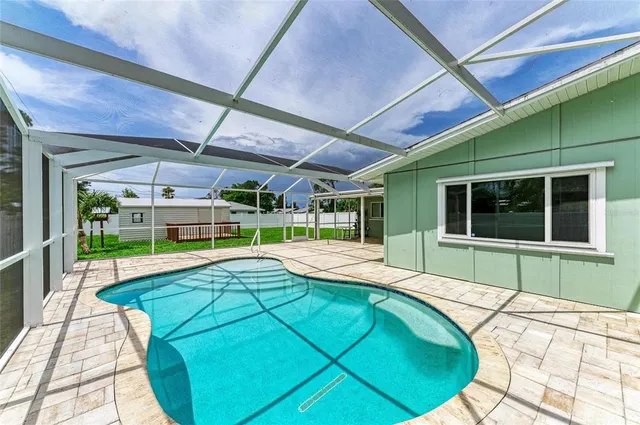 a view of a swimming pool with a patio