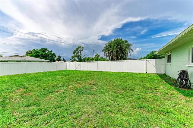 a front view of a house with a garden and deck