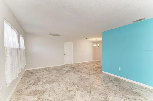 a view of an empty room and window