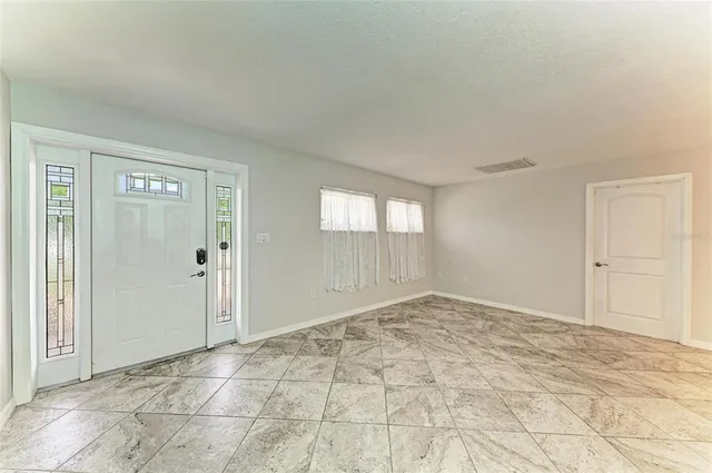 a view of an empty room and window