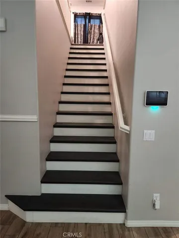 a view of entryway with wooden floor