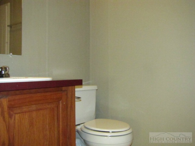 3970 Silas Creek Road Lansing, NC 28643 - Photo 4 of 16 a bathroom with a toilet and a sink