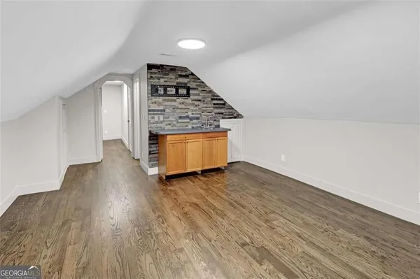 wooden floor in an empty room with a fireplace