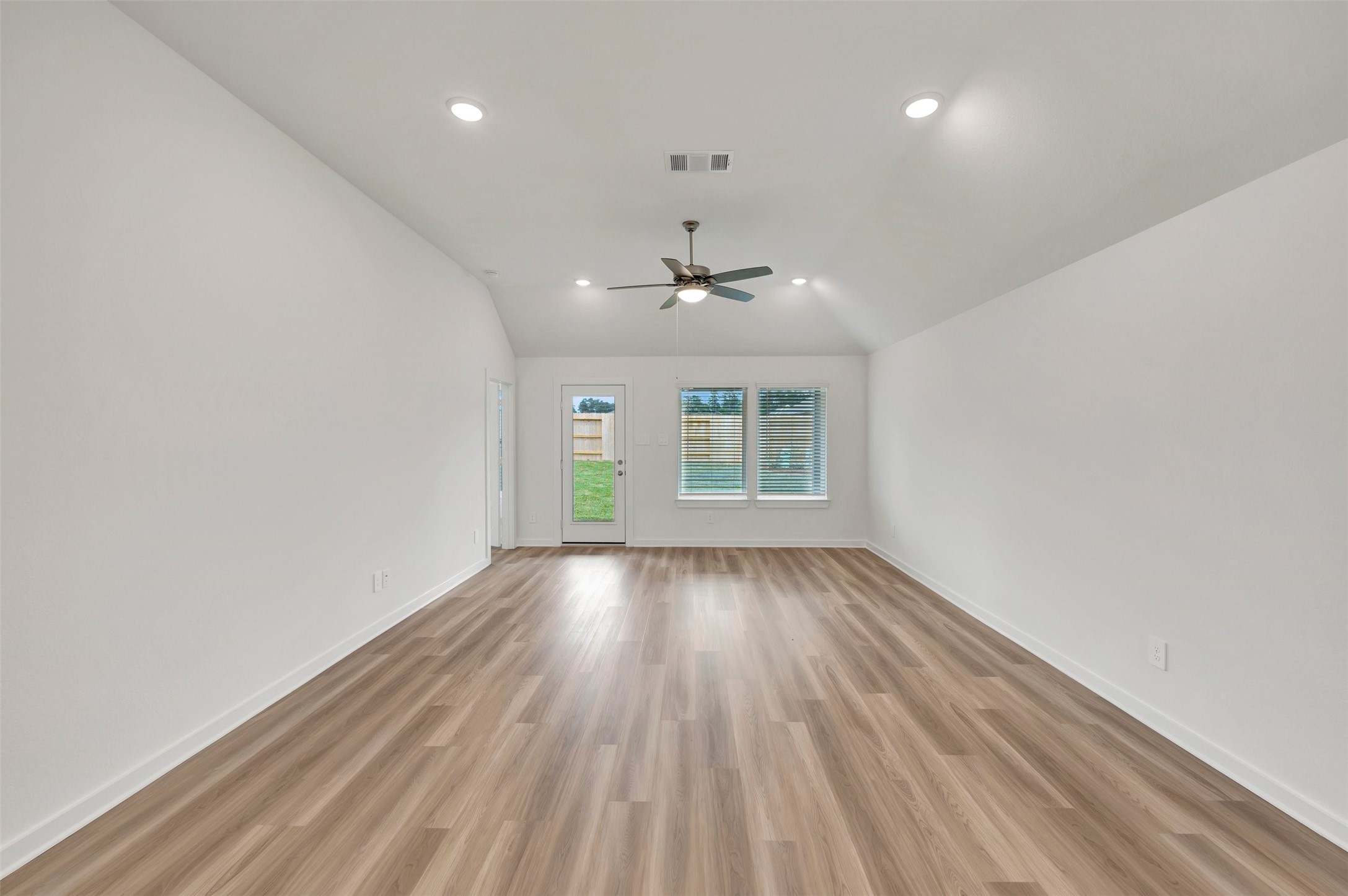 543 Flower Reed Court Magnolia, TX 77354 - Photo 21 of 46 wooden floor in an empty room with a window