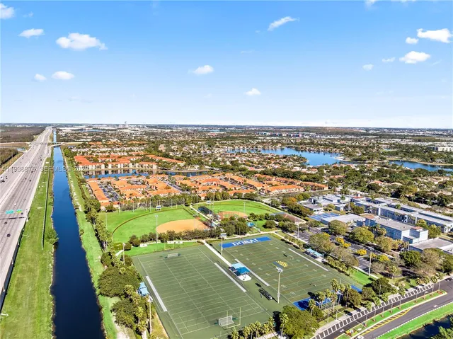 an aerial view of city and lake