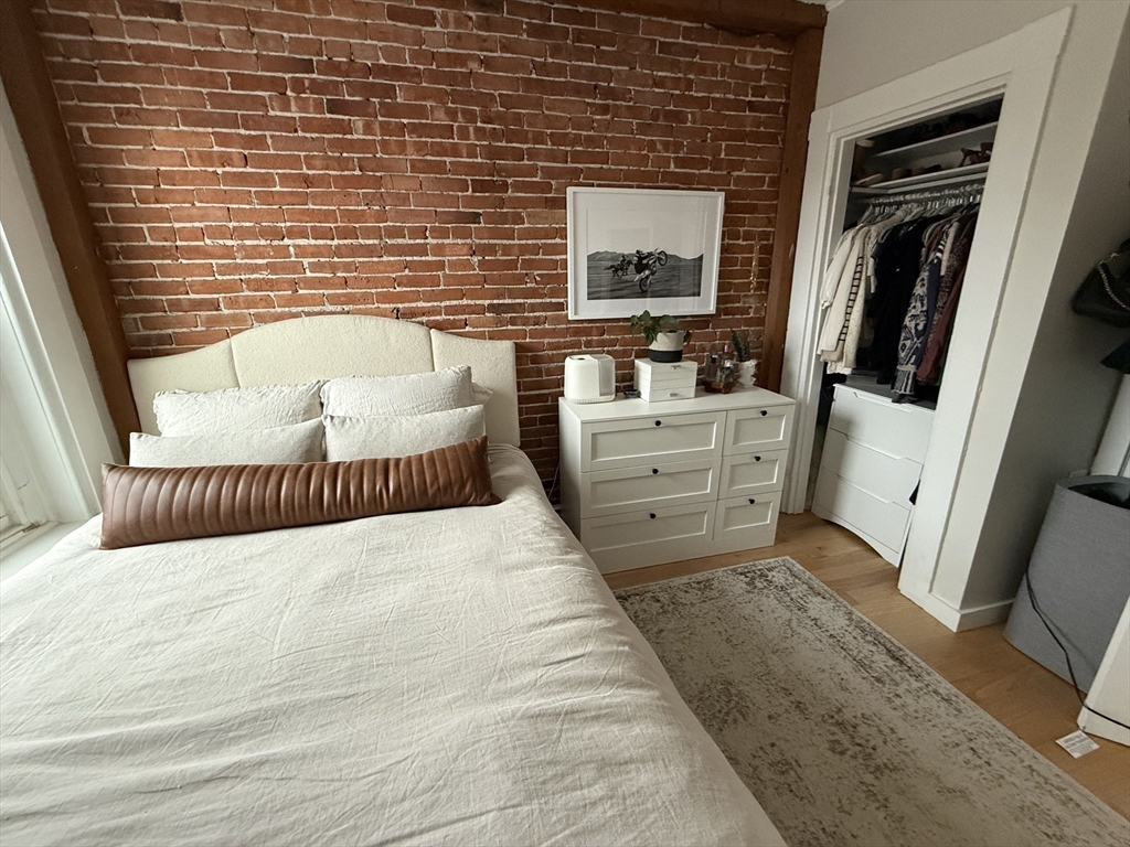 179 Webster Street, Unit 3 Boston, MA 02128 - Photo 6 of 13 a bathroom with a tub sink and mirror