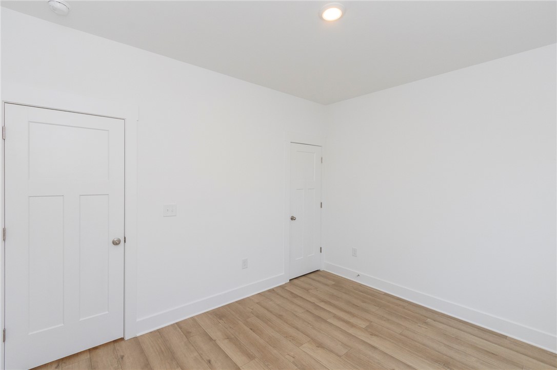 607 WH Kay Lane Anderson, SC 29621 - Photo 15 of 48 Crisp white walls and durable flooring create a welcoming, adaptable bedroom space.