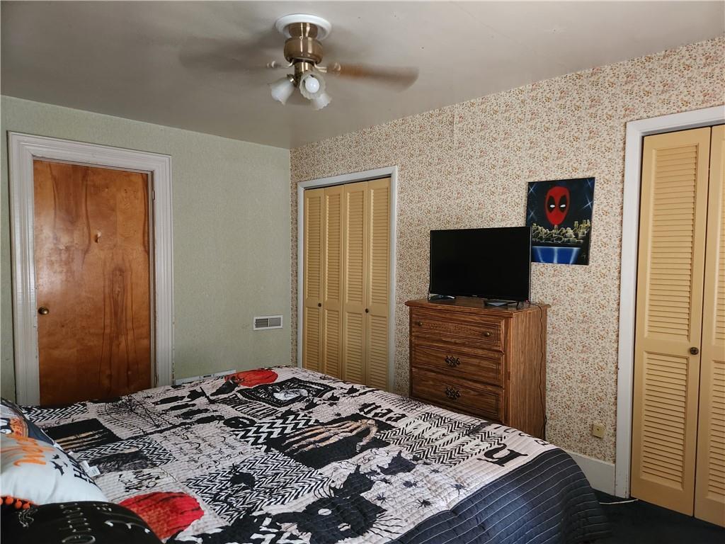 302 South Second Street Apollo, PA 15613 - Photo 11 of 15 a bedroom with a bed and flat screen tv