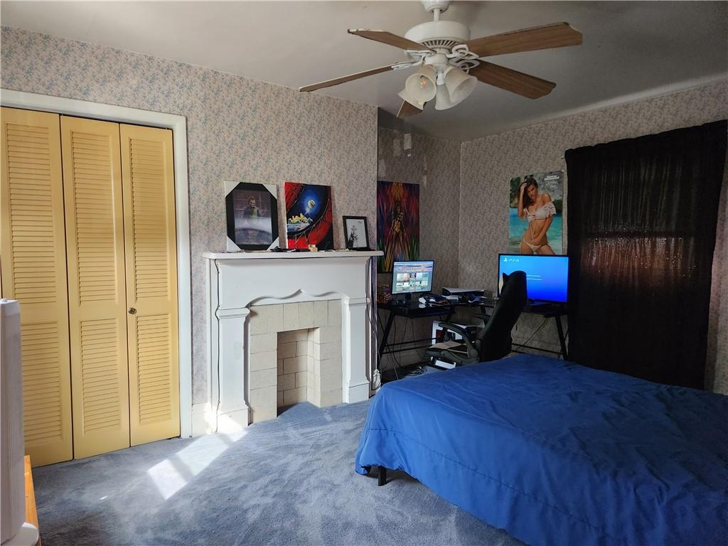 302 South Second Street Apollo, PA 15613 - Photo 14 of 15 a bedroom with a bed and a chandelier