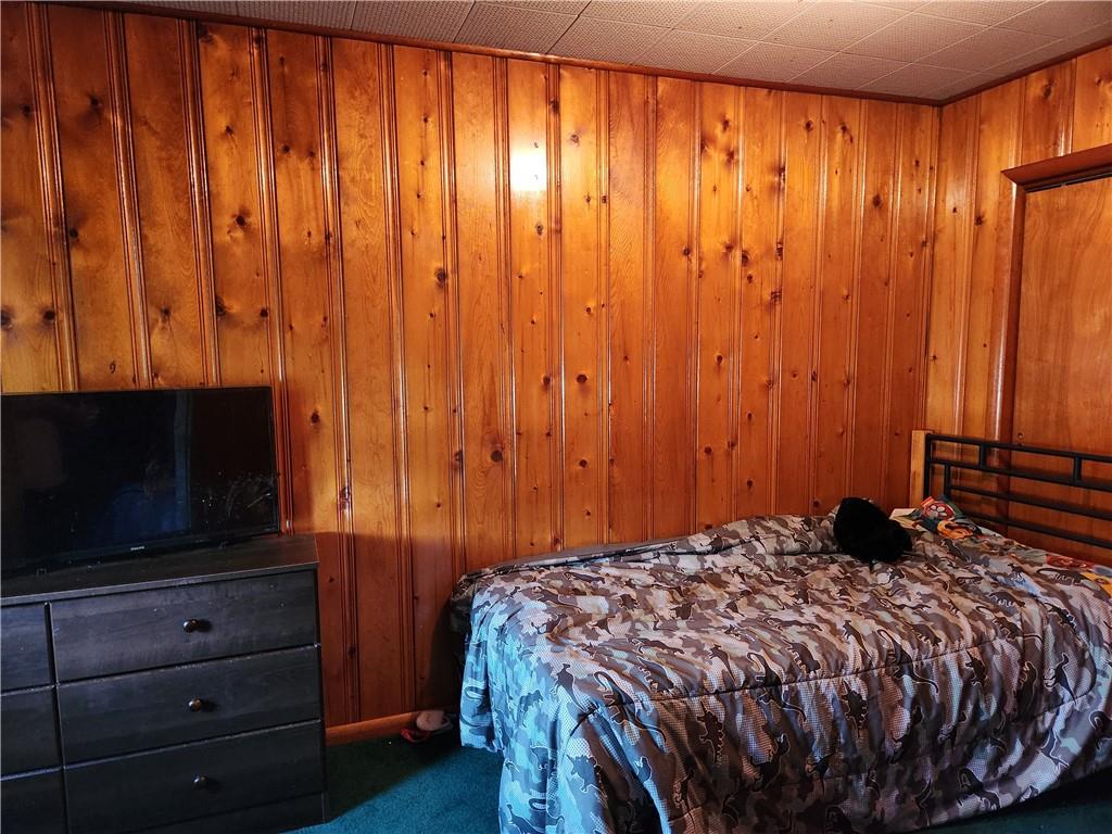 302 South Second Street Apollo, PA 15613 - Photo 15 of 15 a bed sitting in a bedroom next to a window and a flat screen tv