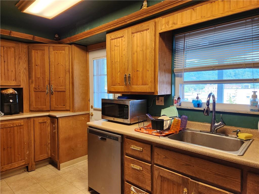 302 South Second Street Apollo, PA 15613 - Photo 6 of 15 a kitchen with a refrigerator a sink and cabinets